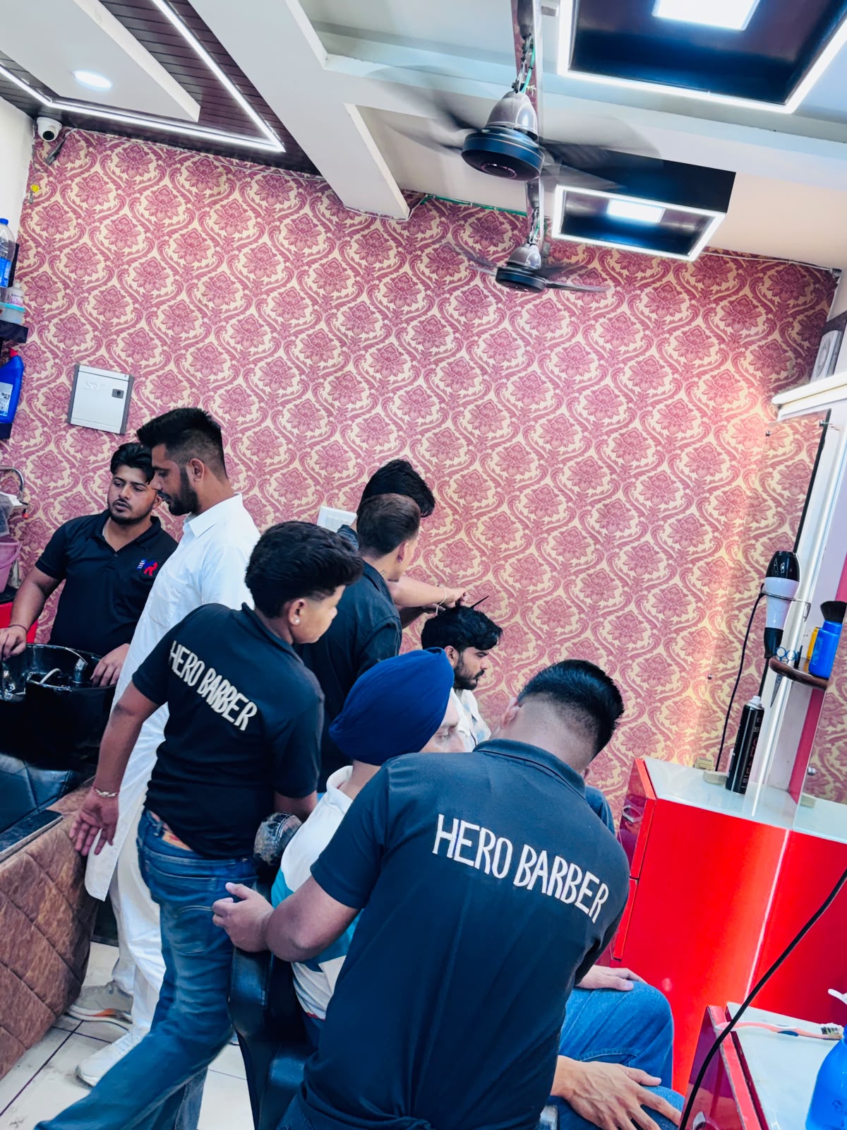 MR HERO BARBER team serving customers inside the Sunam shop