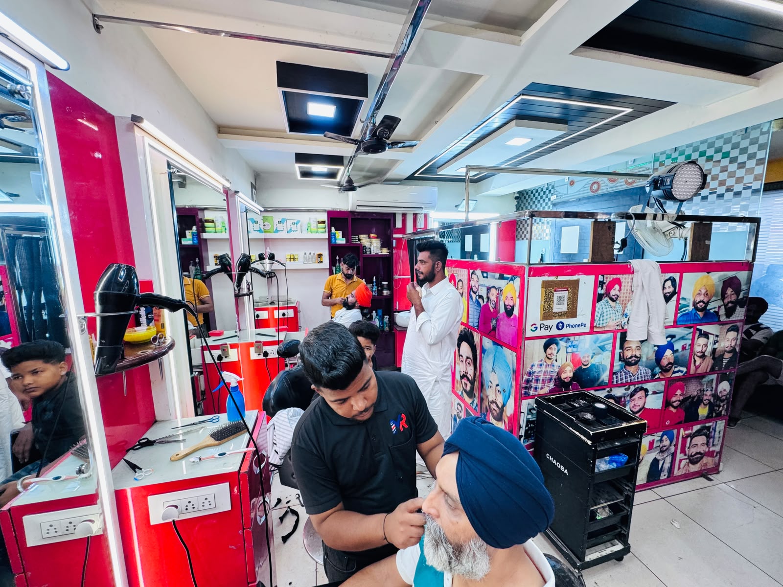 MR HERO BARBER professional providing beard grooming to a customer